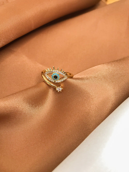 anillo diseño de ojo con piedra azul y brillantes 
